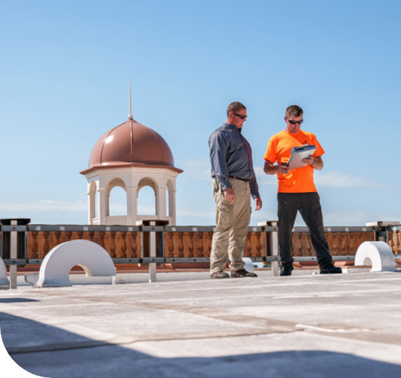 2 men on roof with clipboards